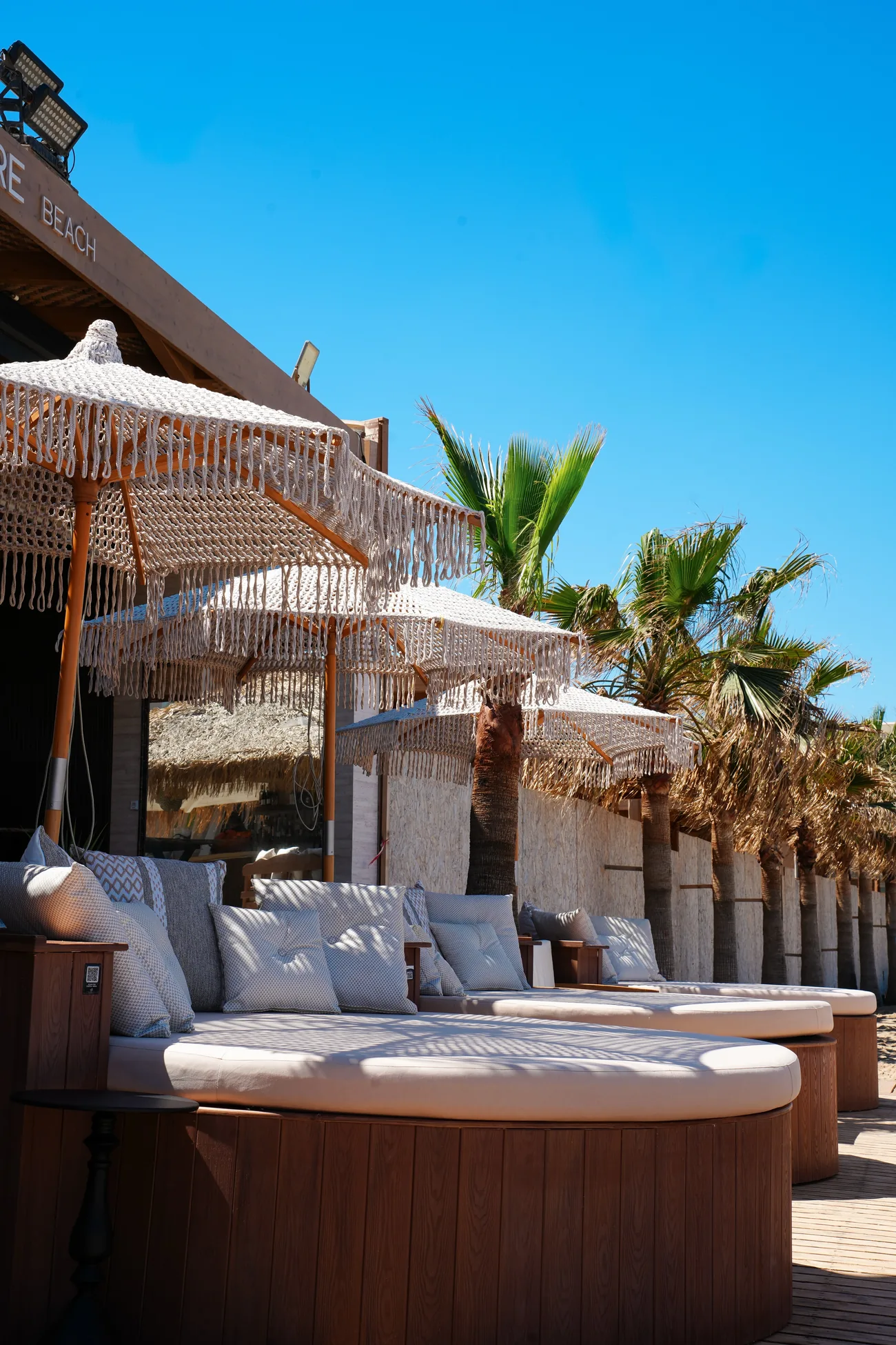 Woven parasols at Pleasure Beach Club